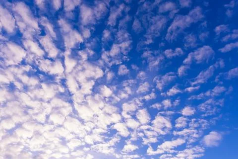 Blue sky background with tiny clouds Stock Photos