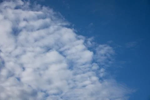 Blue sky background with tiny clouds. Stock Photos