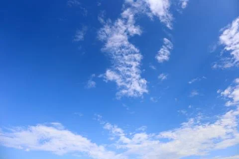 Blue sky background with tiny clouds. Foto stock