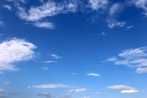 Blue sky background with tiny clouds. Stock Photos