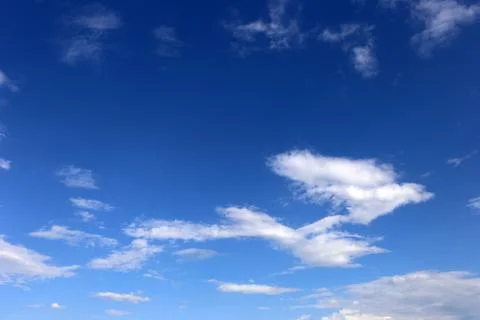 Blue sky background with tiny clouds. Stock Photos