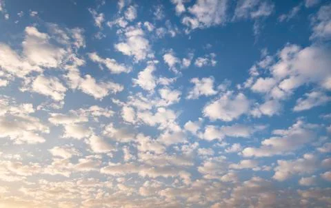 Blue sky background with tiny clouds Stock Photos