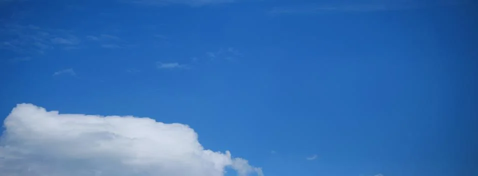 Blue Sky Background with tiny Clouds. Panorama Stock Photos
