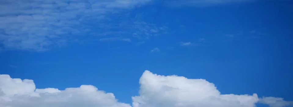 Blue Sky Background with tiny Clouds. Panorama Stock Photos