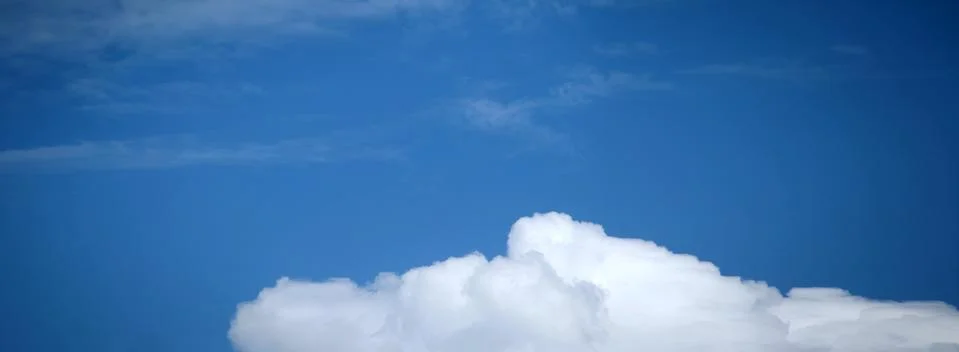 Blue Sky Background with tiny Clouds. Panorama Stock Photos