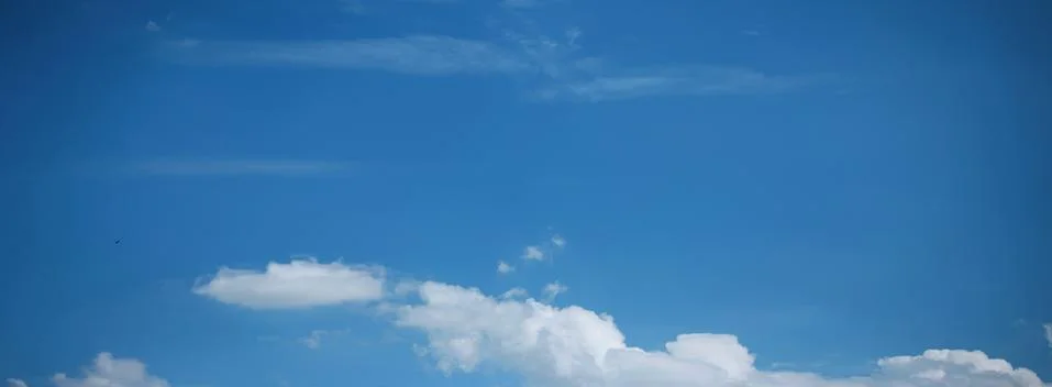 Blue Sky Background with tiny Clouds. Panorama Stock Photos