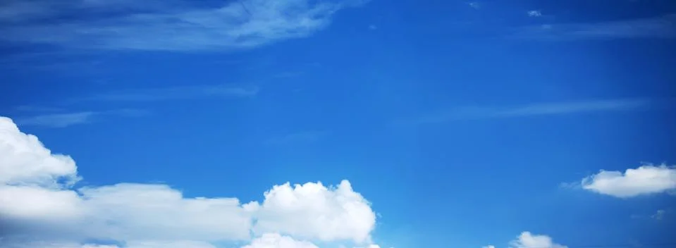 Blue Sky Background with tiny Clouds. Panorama Stock Photos