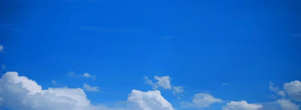 Blue Sky Background with tiny Clouds. Panorama Stock Photos