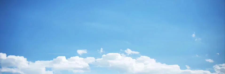 Blue Sky Background with tiny Clouds. Panorama Stock Photos