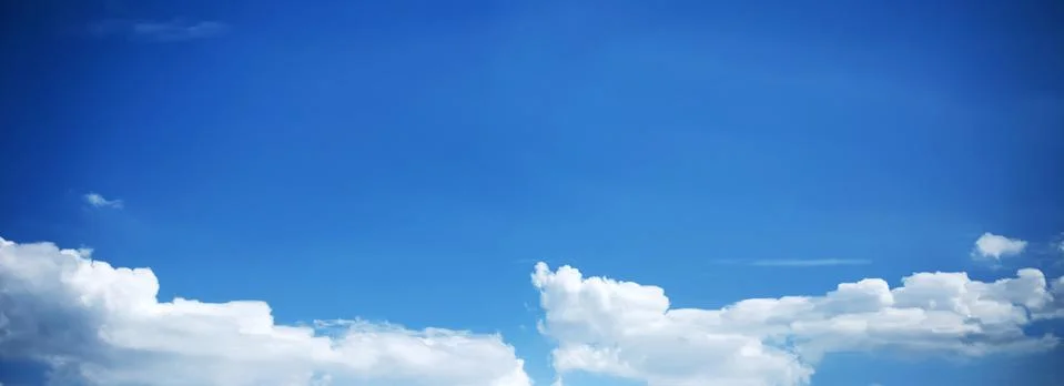 Blue Sky Background with tiny Clouds. Panorama Stock Photos