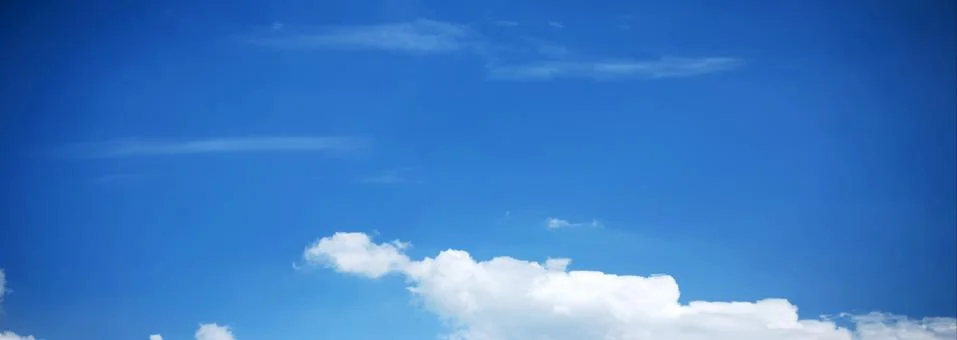 Blue Sky Background with tiny Clouds. Panorama Stock Photos