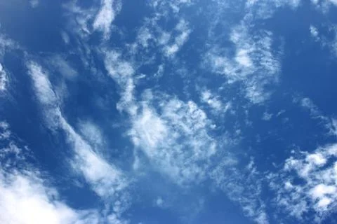 Blue sky background with tiny clouds Stock Photos