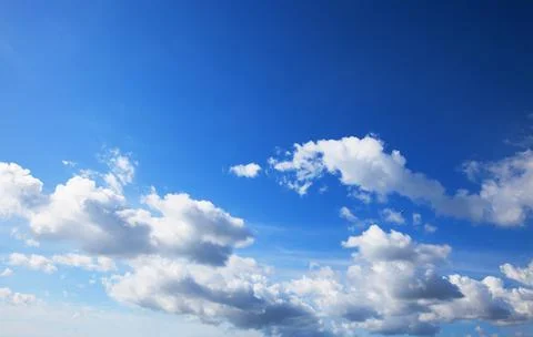 Blue sky background with tiny clouds Stock Photos