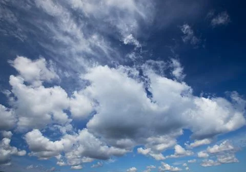 Blue sky background with tiny clouds Stock Photos