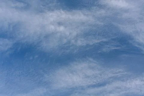 Blue sky background with tiny clouds. Feathery clouds Foto stock