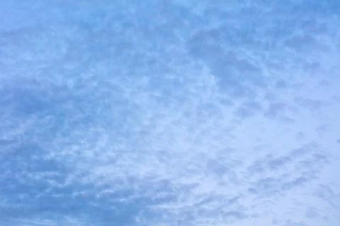 Blue sky background with tiny clouds Foto stock