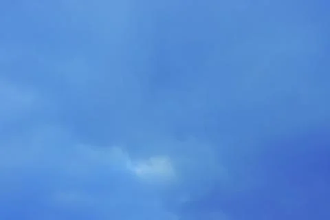 Blue sky background with tiny clouds Stock Photos