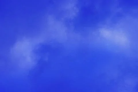 Blue sky background with tiny clouds Stock Photos