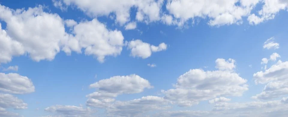 Blue sky background with tiny clouds Foto stock