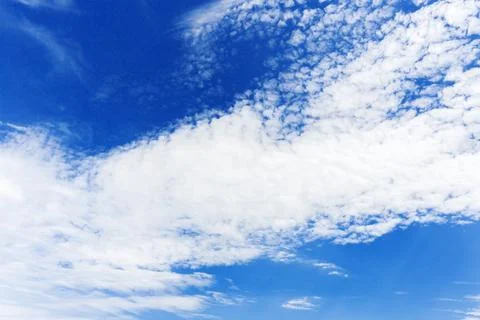 Blue sky background with tiny clouds Stock Photos