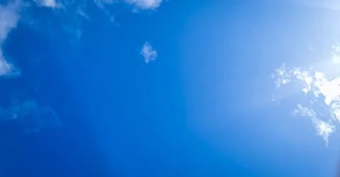 Blue sky background with tiny clouds. Blue sky with tiny clouds. Stock Photos