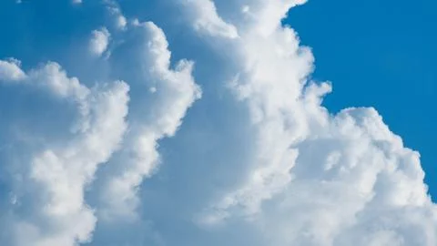 Blue sky background with tiny clouds and space for text. Photos