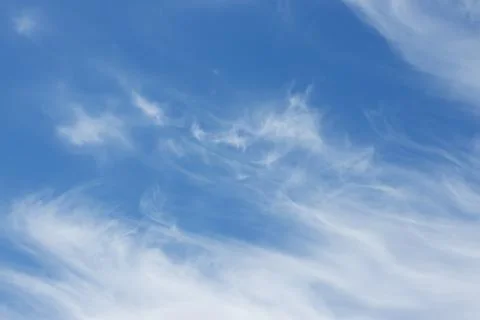 Blue sky background with tiny clouds. Stock Photos