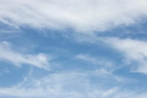 Blue sky background with tiny clouds. Stock Photos