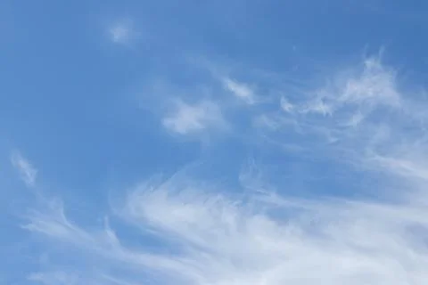 Blue sky background with tiny clouds. 写真素材