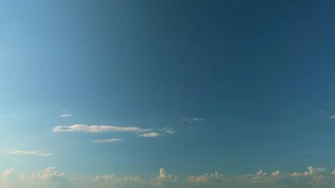 Blue Sky Background With Tiny Clouds. Low Angle View. Blue Clear Sky And White Foto stock