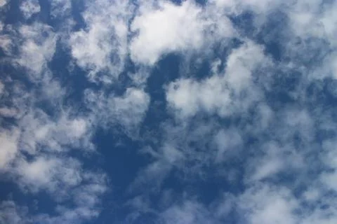 Blue sky background with tiny clouds Stock Photos