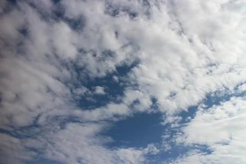 Blue sky background with tiny clouds Stock Photos