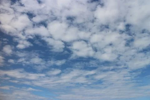 Blue sky background with tiny clouds Stock Photos