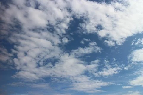 Blue sky background with tiny clouds Stock Photos