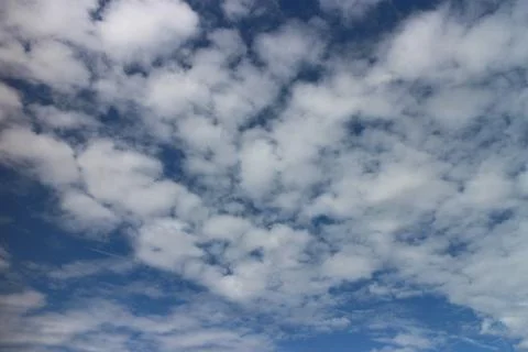 Blue sky background with tiny clouds 写真素材