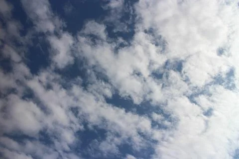 Blue sky background with tiny clouds Foto stock