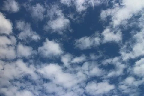 Blue sky background with tiny clouds Stock Photos