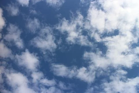 Blue sky background with tiny clouds Stock Photos