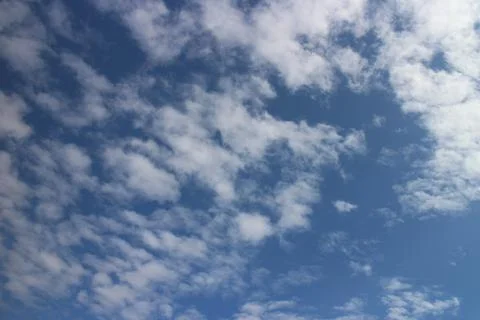 Blue sky background with tiny clouds Stock Photos