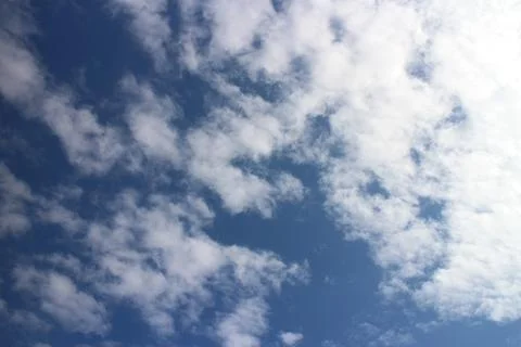 Blue sky background with tiny clouds Stock Photos