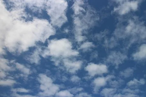 Blue sky background with tiny clouds Stock Photos