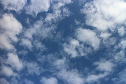 Blue sky background with tiny clouds Stock Photos