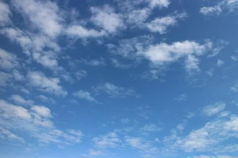 Blue sky background with tiny clouds Stock Photos