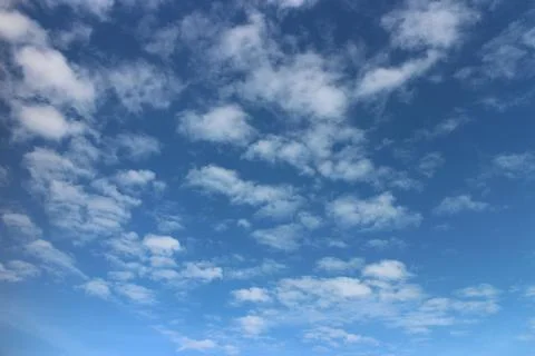 Blue sky background with tiny clouds	 Stock Photos