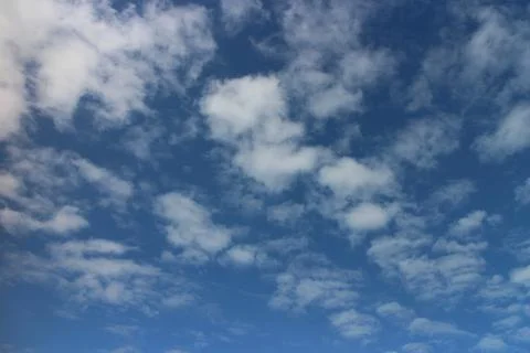 Blue sky background with tiny clouds	 Stock Photos