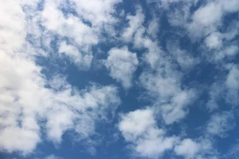 Blue sky background with tiny clouds	 Stock Photos