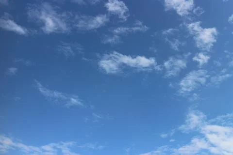 Blue sky background with tiny clouds	 Stock Photos