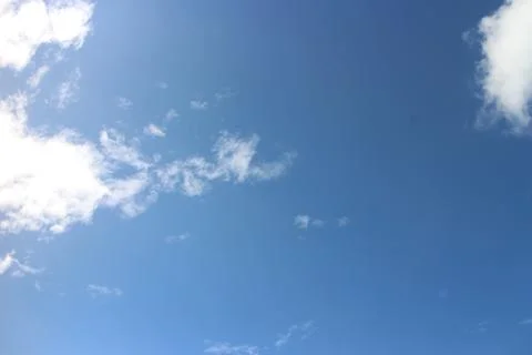 Blue sky background with tiny clouds Stock Photos