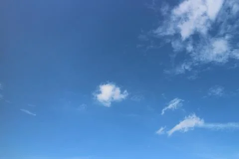 Blue sky background with tiny clouds Stock Photos