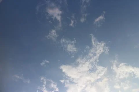 Blue sky background with tiny clouds Stock Photos